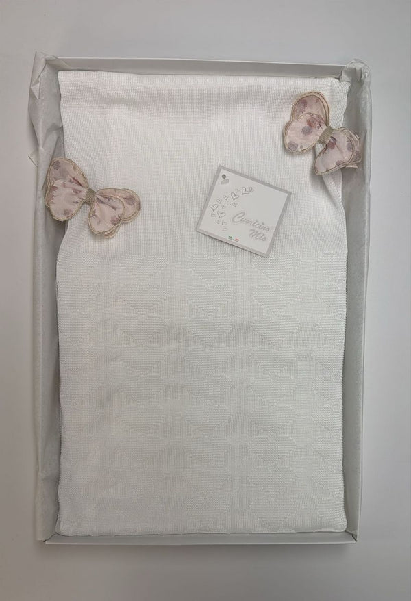 Copertina bianca con fiocchetti rosa